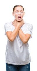Young beautiful caucasian woman over isolated background shouting and suffocate because painful strangle. Health problem. Asphyxiate and suicide concept.