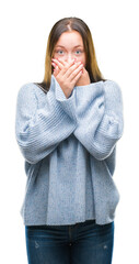 Young beautiful caucasian woman wearing winter sweater over isolated background shocked covering...