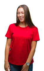 Young beautiful caucasian woman over isolated background winking looking at the camera with sexy...