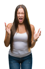 Young caucasian beautiful woman over isolated background crazy and mad shouting and yelling with aggressive expression and arms raised. Frustration concept.
