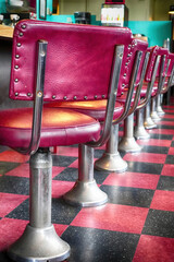 Classic red stools at vintage diner
