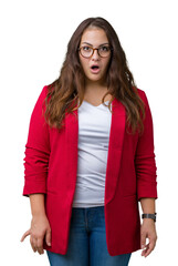 Beautiful plus size young business woman wearing elegant jacket and glasses over isolated background afraid and shocked with surprise expression, fear and excited face.