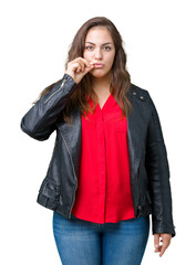 Beautiful plus size young woman wearing a fashion leather jacket over isolated background mouth and...