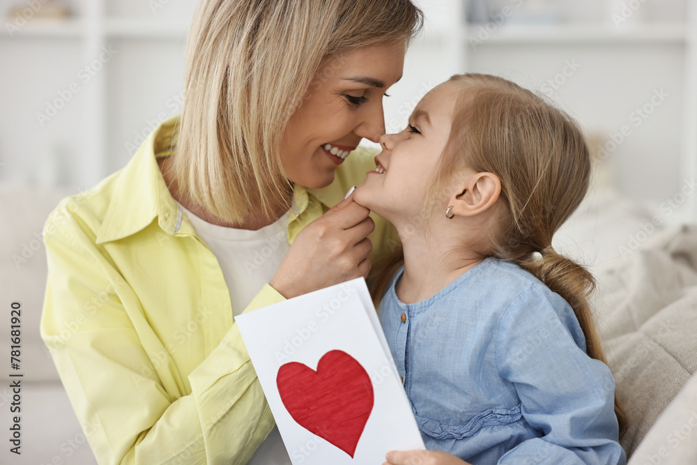 Sticker Little daughter congratulating her mom with greeting card at home. Happy Mother's Day