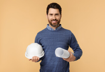 Architect with hard hat and draft on beige background