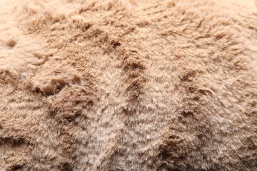 Texture of brown faux fur as background, closeup