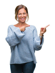 Middle age senior hispanic woman wearing winter sweater over isolated background smiling and...