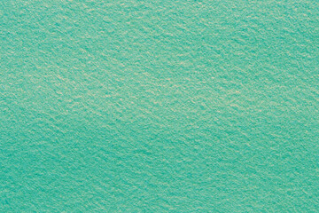 Close up Turquoise green felt abstract background texture. Surface of fabric texture wall...