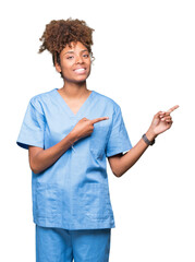 Young african american doctor woman over isolated background smiling and looking at the camera...