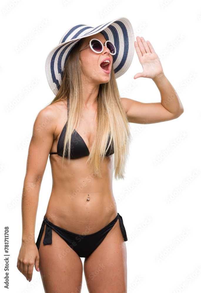 Poster beautiful young woman wearing bikini, sunglasses and hat shouting and screaming loud to side with ha