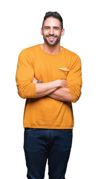 Young handsome man over isolated background happy face smiling with crossed arms looking at the camera. Positive person.