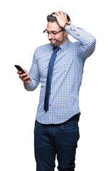 Young business man using smartphone over isolated background stressed with hand on head, shocked with shame and surprise face, angry and frustrated. Fear and upset for mistake.