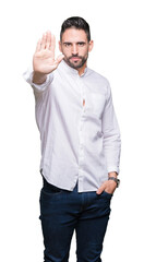 Young business man over isolated background doing stop sing with palm of the hand. Warning expression with negative and serious gesture on the face.