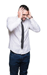 Young handsome business man wearing glasses over isolated background suffering from headache desperate and stressed because pain and migraine. Hands on head.