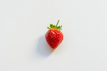 Red berry strawberry with leaves isolated on white background