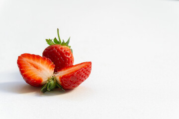 Red berry strawberry with leaves isolated on white background