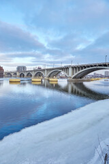 Bridge in downtown Minneapolis Minnesota going across the Mississippi River on a cold winter day