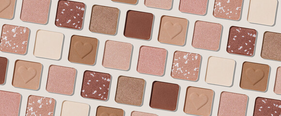 Trend pattern with refill eye shadow swatches, beige brown natural colors on light background, wide banner. Eyeshadows powder for make up, shiny and matte, minimal aesthetic photo, pastel color