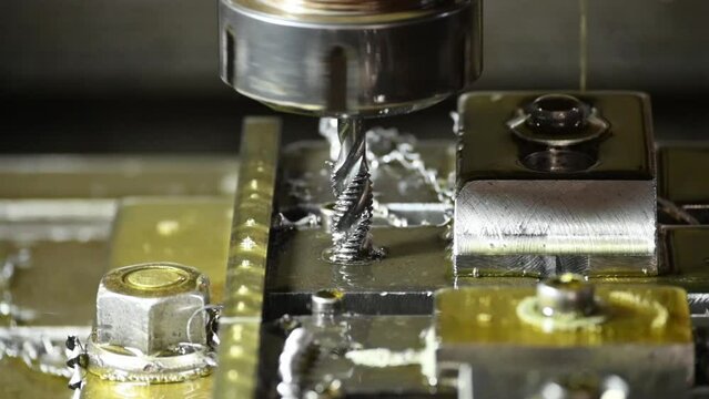 The tapping process on the  CNC milling machine with tapping tools.
