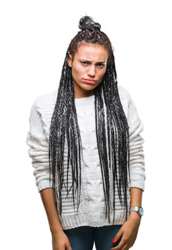 Young braided hair african american girl wearing sweater over isolated background depressed and worry for distress, crying angry and afraid. Sad expression.