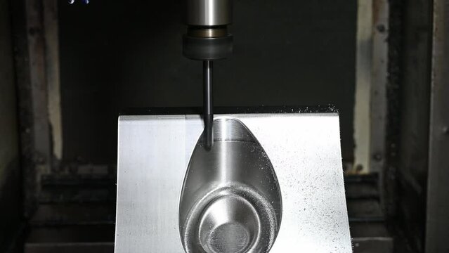 The CNC milling machine cutting  press die part by solid ball end mill tool.