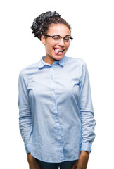 Young braided hair african american business girl wearing glasses over isolated background winking...