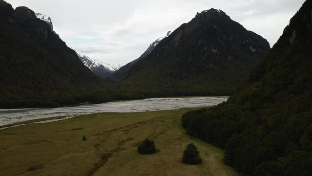 The Dart River winding through paradise surrounded by majestic peaks dusted with snow. New Zealand.