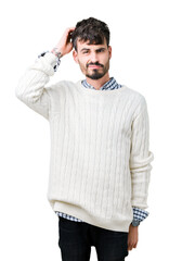 Fototapeta premium Young handsome man wearing winter sweater over isolated background confuse and wonder about question. Uncertain with doubt, thinking with hand on head. Pensive concept.