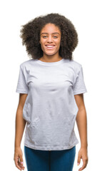 Young afro american woman over isolated background with a happy and cool smile on face. Lucky...