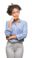 Young afro american woman over isolated background with hand on chin thinking about question,...