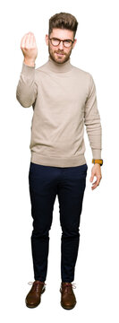 Young handsome business man wearing glasses Doing Italian gesture with hand and fingers confident expression