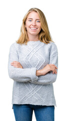 Beautiful young woman wearing winter sweater over isolated background happy face smiling with crossed arms looking at the camera. Positive person.