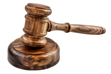wooden gavel with a gold band sits on a wooden base. The gavel is used by judges to make decisions in courtrooms.