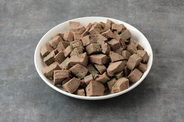 Boiled cow liver on white plate
