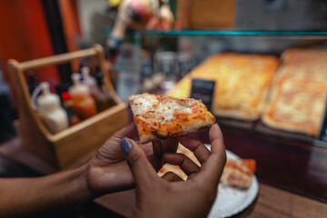 Pizza is sold in front of a shop on Walking Street