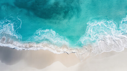 An aerial view capturing the turquoise ocean waves gently meeting the sandy beach, evoking serenity and natural beauty - obrazy, fototapety, plakaty