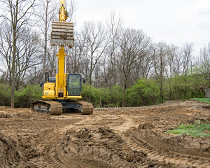 Excavator Bucket Lowering to Scoop Dirt