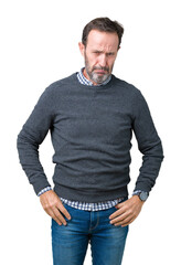 Fototapeta premium Handsome middle age senior man wearing a sweater over isolated background depressed and worry for distress, crying angry and afraid. Sad expression.