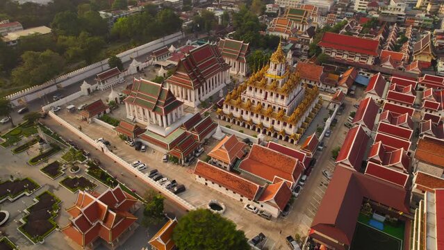 Amazing Wat Ratchanatdaram temple in Bangkok at dawn. Aerial gimbal up