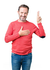 Handsome middle age hoary senior man wearing winter sweater over isolated background Swearing with...