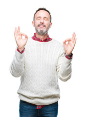 Middle age hoary senior man wearing winter sweater over isolated background relax and smiling with eyes closed doing meditation gesture with fingers. Yoga concept.