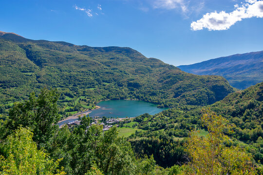 Panoramic view of the Eriste reservoir surrounded by green forests. Benasque Valley. Pyrenees. Huesca. Aragon. Spain