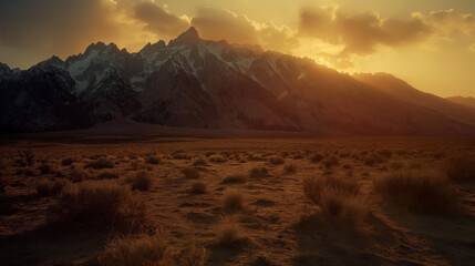 Warm golden light floods the scene, accentuating the rugged texture of an expansive mountain range during sunset - obrazy, fototapety, plakaty