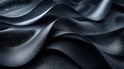   A tight shot of black-and-white fabric with water droplets atop its curved surface