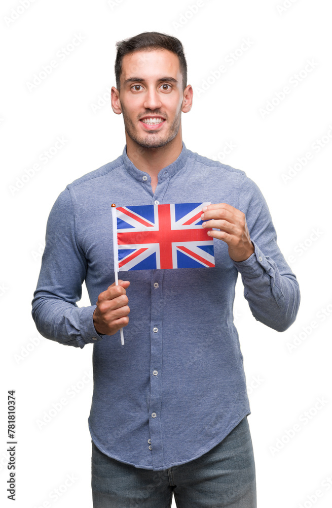 Poster handsome young man holding a flag of united kingdom with a happy face standing and smiling with a co