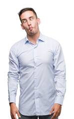 Fototapeta premium Handsome young businessman making fish face with lips, crazy and comical gesture. Funny expression.