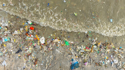 Top view of trash, plastic cups and plastic bags at the beach. environmental problem concept and healing the world