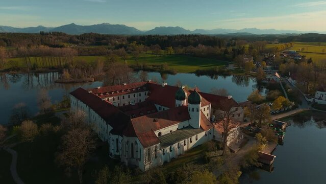 Bavarian Kloster Seeon monastery. Catholic church on lake island. Scenic alps mountains aerial