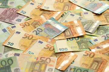 Obraz na płótnie Canvas Many european euro money bills. Lot of banknotes of european union currency close up