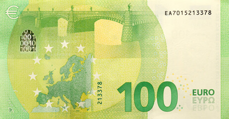 Fragment of one hundred euro money bill. Details of European union currency banknote of 100 euro close up